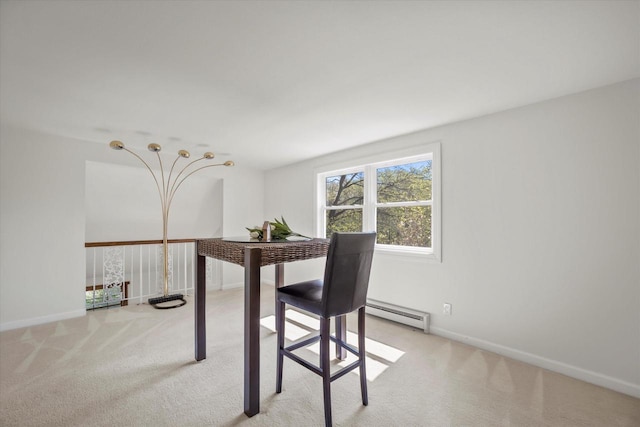 1401 Scenic Dr, Hubertus, WI 53033 - dining space featuring a baseboard radiator, light carpet, and baseboards