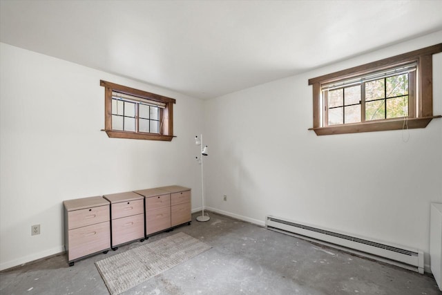 1401 Scenic Dr, Hubertus, WI 53033 - unfurnished room with a baseboard heating unit, baseboards, and concrete flooring