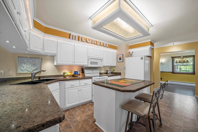 1401 Scenic Dr, Hubertus, WI 53033 - kitchen featuring white appliances, dark countertops, a breakfast bar, a baseboard heating unit, and a sink