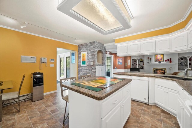 1401 Scenic Dr, Hubertus, WI 53033 - kitchen featuring dishwasher, a kitchen island, ornamental molding, healthy amount of natural light, and a sink