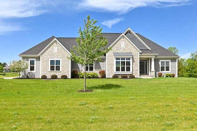S89W35217 Amber Ct, Eagle, WI 53119 - craftsman-style house with stone siding, a front yard, and a shingled roof