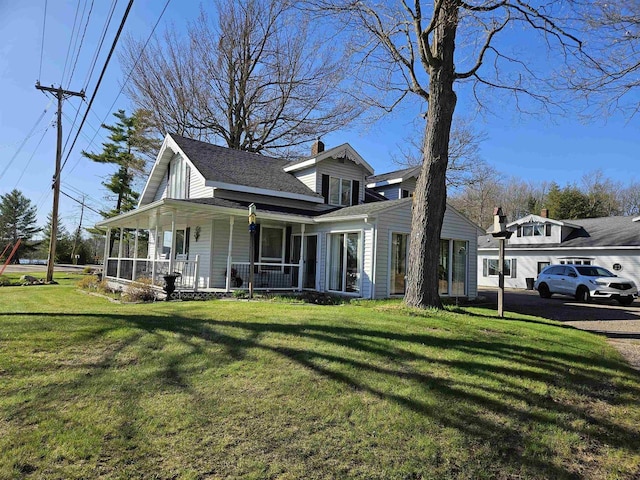 1226 Lake St, White Lake, WI 54491 - view of front of home featuring a porch, a front lawn, a chimney, and a shingled roof