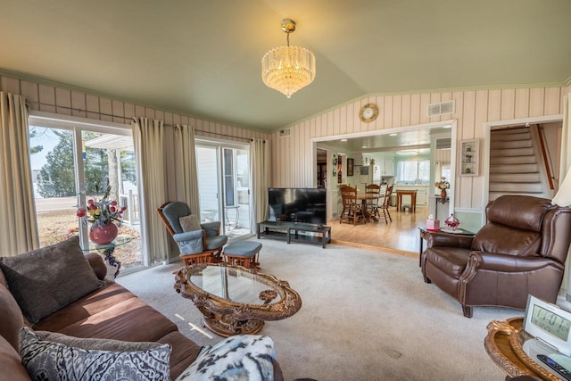 1226 Lake St, White Lake, WI 54491 - living room featuring a chandelier, healthy amount of natural light, carpet, vaulted ceiling, and stairway
