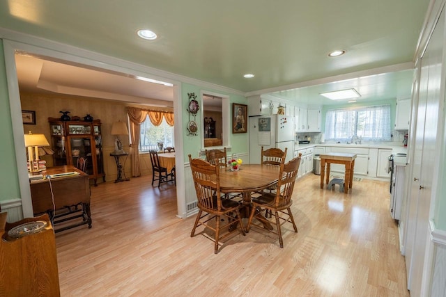 1226 Lake St, White Lake, WI 54491 - dining space featuring light wood-style floors, recessed lighting, and ornamental molding