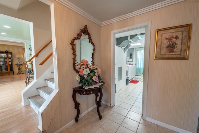 1226 Lake St, White Lake, WI 54491 - hall featuring crown molding, stairway, baseboards, and light tile patterned floors