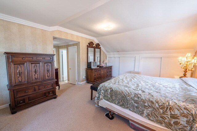 1226 Lake St, White Lake, WI 54491 - bedroom with light carpet, vaulted ceiling, baseboards, and a chandelier