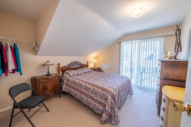 1226 Lake St, White Lake, WI 54491 - carpeted bedroom with vaulted ceiling and access to exterior