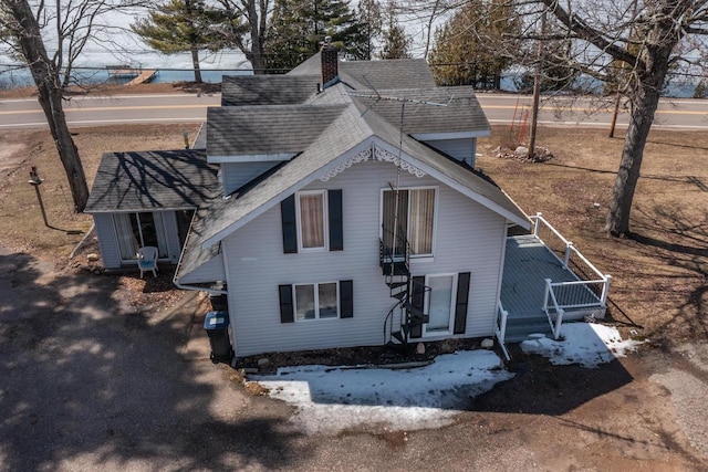 1226 Lake St, White Lake, WI 54491 - rear view of house with roof with shingles, a chimney, and a deck