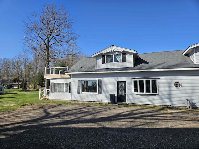 1226 Lake St, White Lake, WI 54491 - view of front of house featuring a balcony and a sunroom