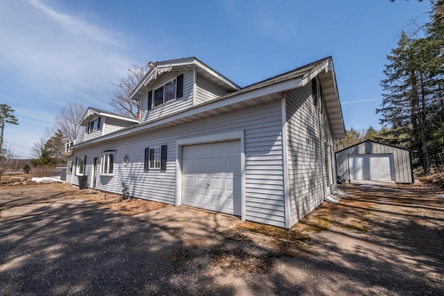 1226 Lake St, White Lake, WI 54491 - view of property exterior featuring a garage and asphalt driveway