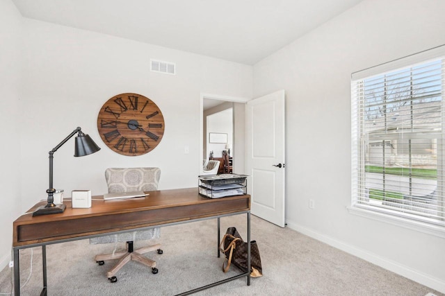 W139S9977 Jay Dr, Muskego, WI 53150 - home office with healthy amount of natural light, baseboards, and light colored carpet