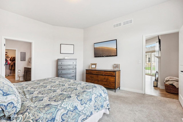 W139S9977 Jay Dr, Muskego, WI 53150 - carpeted bedroom with baseboards and ensuite bath
