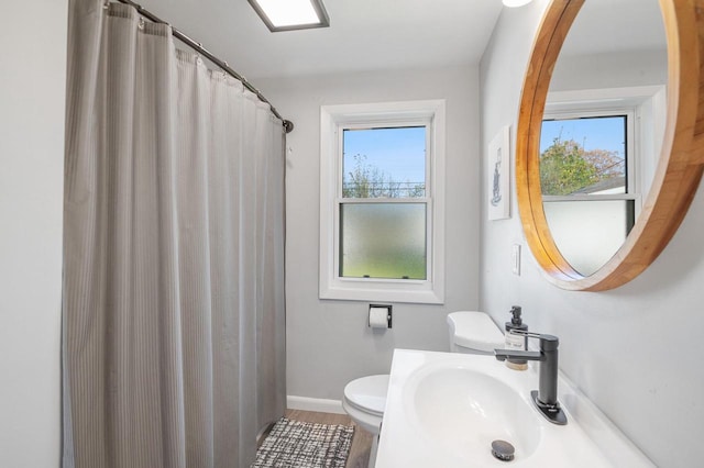 1201 Redwood Dr, Green Bay, WI 54304 - full bathroom with plenty of natural light, toilet, vanity, and wood finished floors