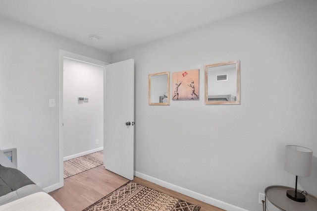 1201 Redwood Dr, Green Bay, WI 54304 - living area featuring light wood-style floors and baseboards