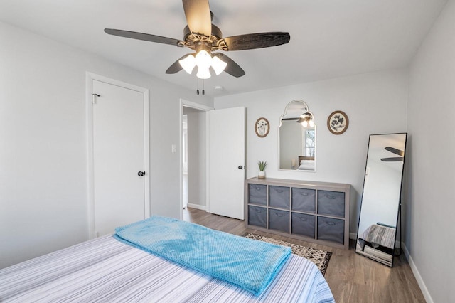 1201 Redwood Dr, Green Bay, WI 54304 - bedroom featuring wood finished floors, baseboards, and ceiling fan