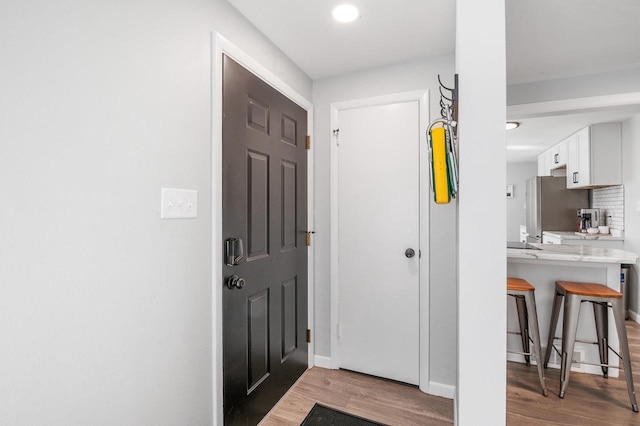 1201 Redwood Dr, Green Bay, WI 54304 - entrance foyer featuring light wood finished floors, baseboards, and recessed lighting
