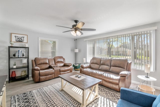1201 Redwood Dr, Green Bay, WI 54304 - living room with wood finished floors, ceiling fan, and baseboards