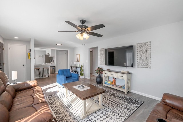 1201 Redwood Dr, Green Bay, WI 54304 - living area with wood finished floors, ceiling fan, baseboards, and recessed lighting