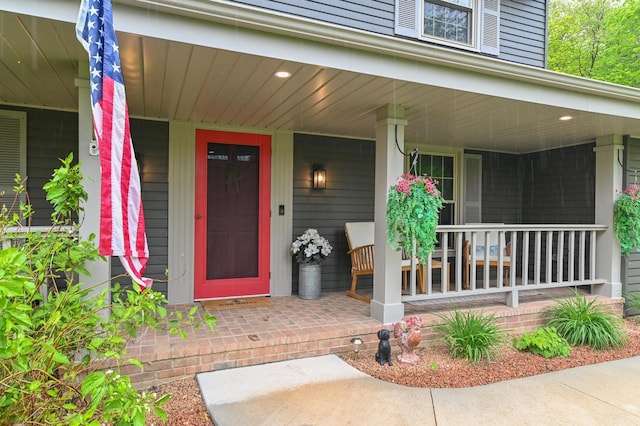 5458 Cascade Dr, West Bend, WI 53095 - property entrance featuring covered porch
