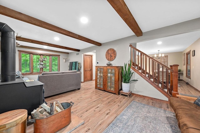 5458 Cascade Dr, West Bend, WI 53095 - living room with recessed lighting, stairway, beam ceiling, wood finished floors, and a chandelier
