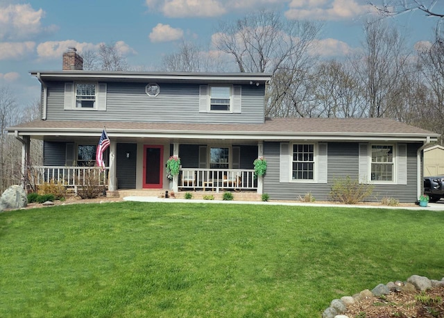 5458 Cascade Dr, West Bend, WI 53095 - view of front of home featuring covered porch, a chimney, and a front yard