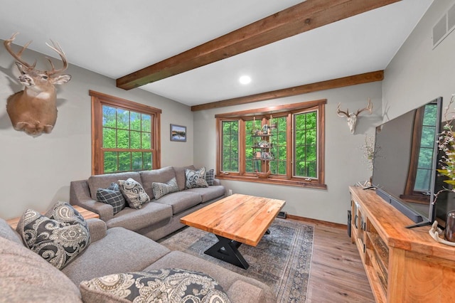5458 Cascade Dr, West Bend, WI 53095 - living room featuring light wood-style floors, beamed ceiling, plenty of natural light, baseboards, and recessed lighting