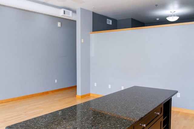 615 W Main St Unit 205, Madison, WI 53703 - spare room featuring baseboards and light wood-style floors