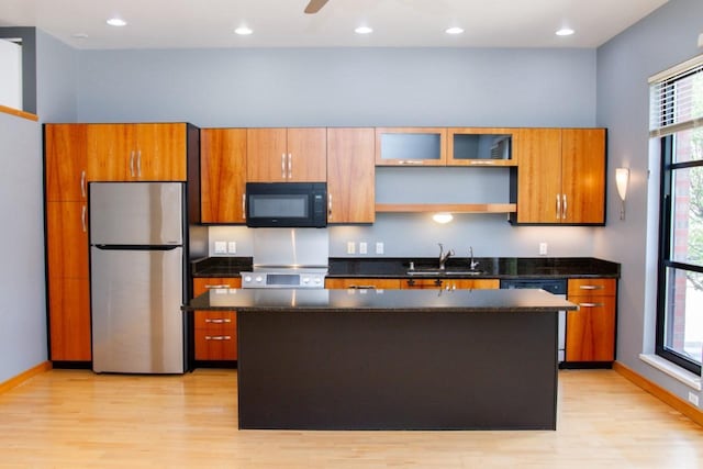 615 W Main St Unit 205, Madison, WI 53703 - kitchen featuring freestanding refrigerator, black microwave, electric range oven, light wood-style floors, and recessed lighting