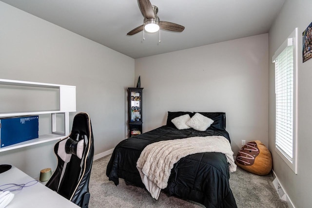 bedroom with carpet flooring, multiple windows, and baseboards
