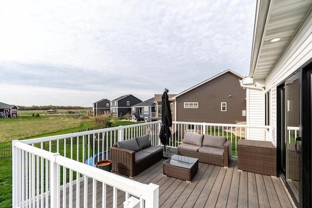 deck with outdoor lounge area and a yard