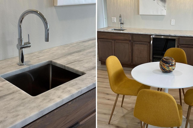 kitchen featuring a sink, wine cooler, light countertops, and dark brown cabinets