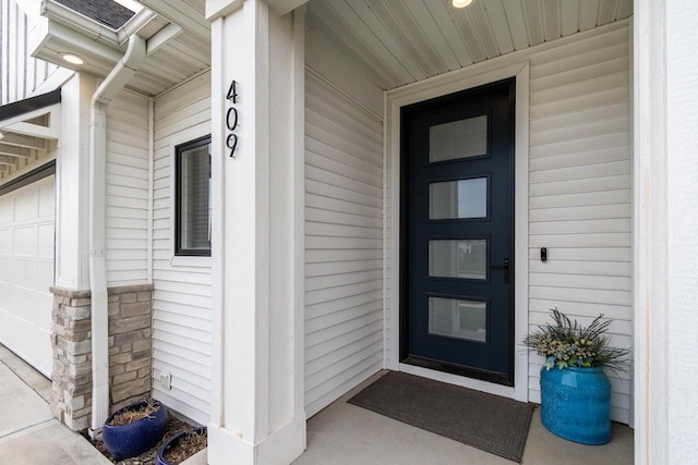 property entrance featuring a garage