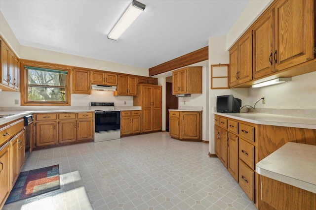 5287 Pleasant Hill Rd, Hartford, WI 53027 - kitchen featuring electric range oven, under cabinet range hood, and brown cabinetry