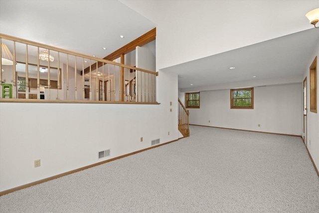 5287 Pleasant Hill Rd, Hartford, WI 53027 - unfurnished living room featuring stairway, carpet floors, baseboards, and recessed lighting