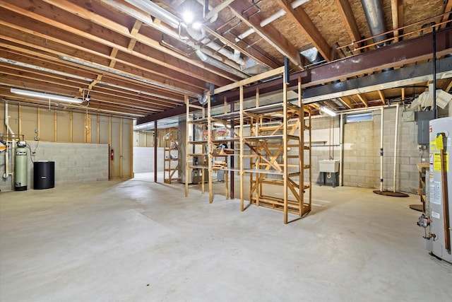 5287 Pleasant Hill Rd, Hartford, WI 53027 - unfinished basement with water heater, a sink, a water softener system, and concrete block wall