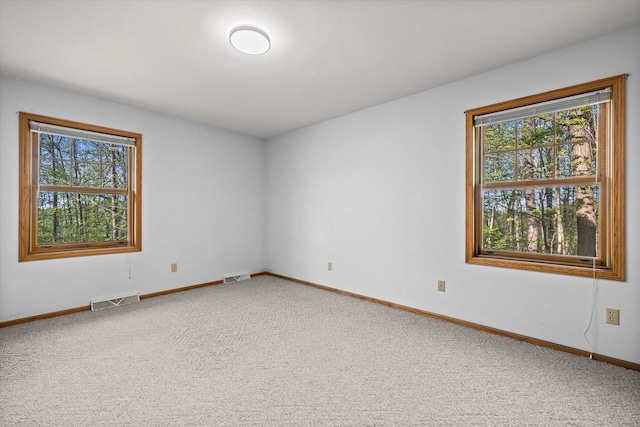 5287 Pleasant Hill Rd, Hartford, WI 53027 - spare room featuring healthy amount of natural light, light carpet, and baseboards