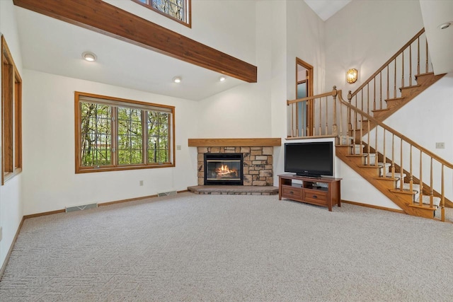 5287 Pleasant Hill Rd, Hartford, WI 53027 - unfurnished living room with carpet, stairway, a fireplace, baseboards, and high vaulted ceiling
