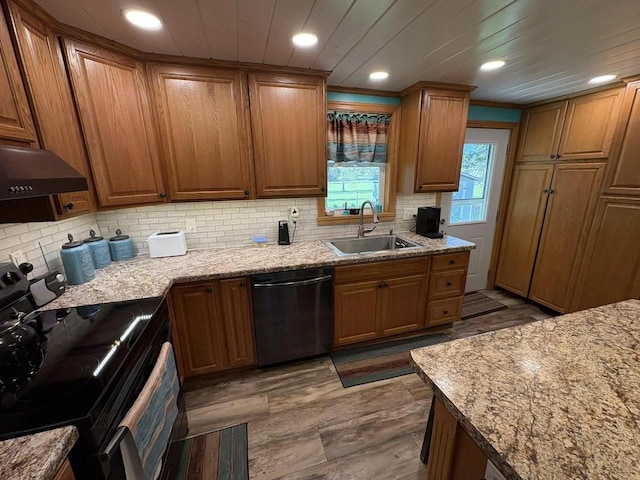 121 W Clark St, Plainfield, WI 54966 - kitchen featuring dishwasher, black electric range oven, a sink, brown cabinets, and recessed lighting