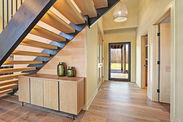 W4310 33rd St, Necedah, WI 54646 - hallway featuring wood finished floors, baseboards, and stairway
