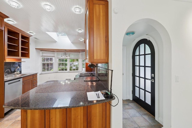 923 Swarthmore Ct, Madison, WI 53705 - kitchen with stainless steel dishwasher, a sink, brown cabinetry, decorative backsplash, and open shelves