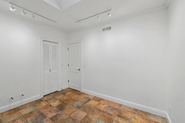 923 Swarthmore Ct, Madison, WI 53705 - unfurnished room featuring track lighting, baseboards, crown molding, and stone finish floors