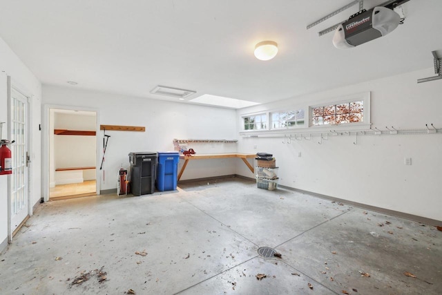 923 Swarthmore Ct, Madison, WI 53705 - garage with a garage door opener and baseboards