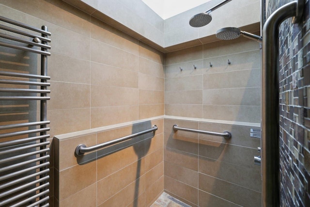 923 Swarthmore Ct, Madison, WI 53705 - full bathroom with radiator, a towel warmer, and a tile shower