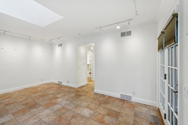 923 Swarthmore Ct, Madison, WI 53705 - unfurnished room featuring rail lighting, ornamental molding, light stone finish floors, and baseboards