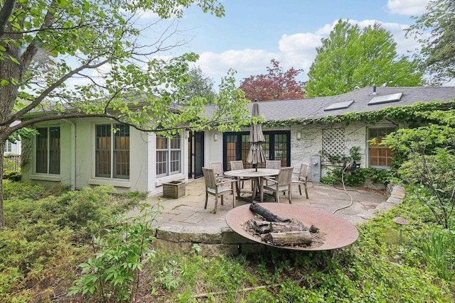 923 Swarthmore Ct, Madison, WI 53705 - rear view of house featuring a patio, french doors, and stucco siding
