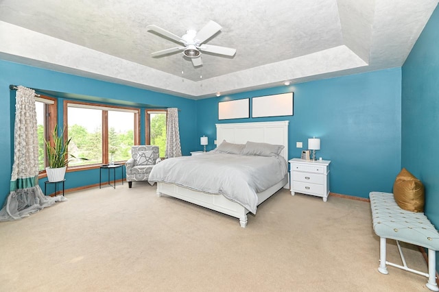 7601 S Cambridge Dr, Franklin, WI 53132 - bedroom featuring a tray ceiling, carpet, baseboards, a textured ceiling, and ceiling fan