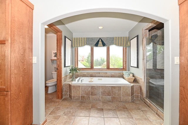7601 S Cambridge Dr, Franklin, WI 53132 - bathroom featuring plenty of natural light, toilet, a garden tub, and a shower stall