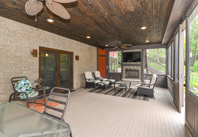 7601 S Cambridge Dr, Franklin, WI 53132 - sunroom / solarium with ceiling fan and an outdoor living space with a fireplace
