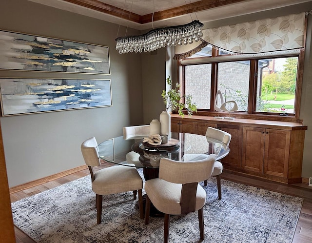 7601 S Cambridge Dr, Franklin, WI 53132 - dining room featuring wood finished floors, baseboards, and a raised ceiling
