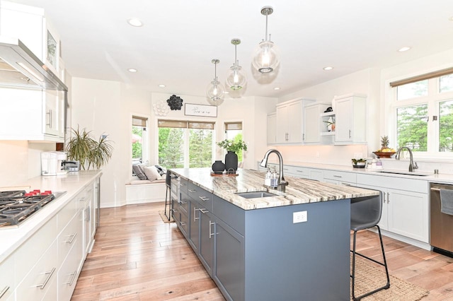 7601 S Cambridge Dr, Franklin, WI 53132 - kitchen featuring a sink, appliances with stainless steel finishes, white cabinets, an island with sink, and recessed lighting